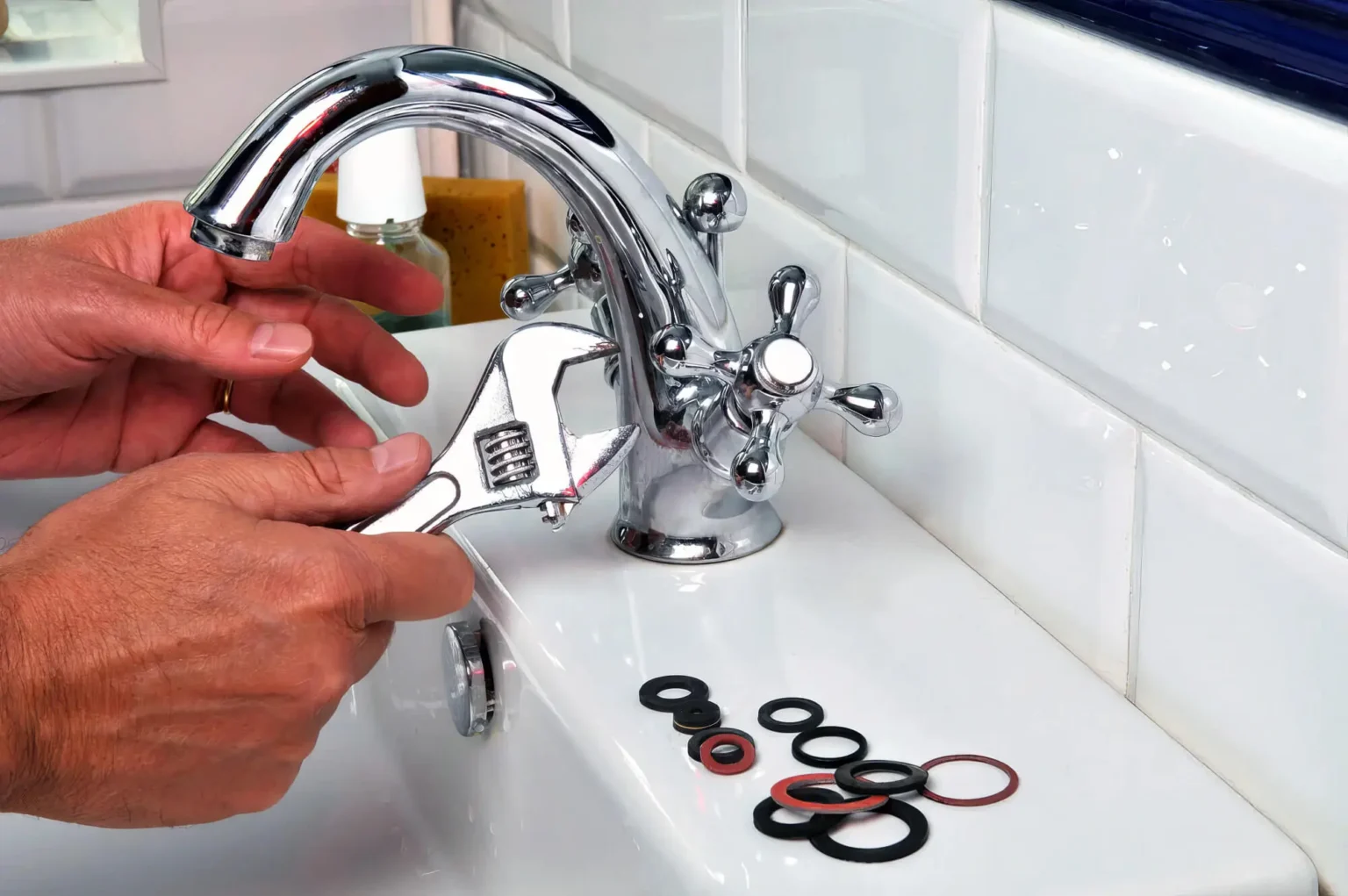 Plumber maintaining a bathroom faucet in San Bruno