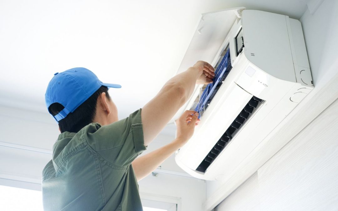 HVAC technician servicing a ductless mini split in San Bruno